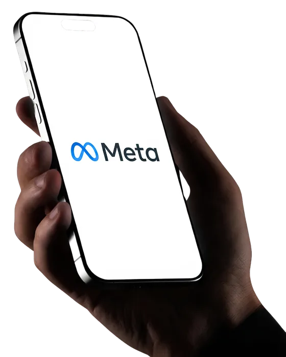 Hand holding a phone showing the Meta logo, representing the Facebook and Instagram ads Untitled Creative runs for Australian businesses
